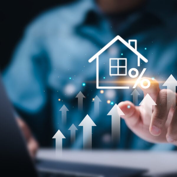 Man touch virtual house icon for analyzing mortgage loan home and insurance real property mortgage. interest rate, Investment planning, business real estate.